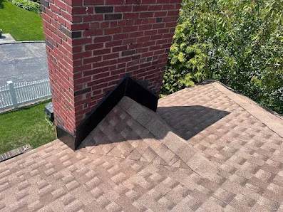 Flat work area and gutters showing drainage considerations during roof service